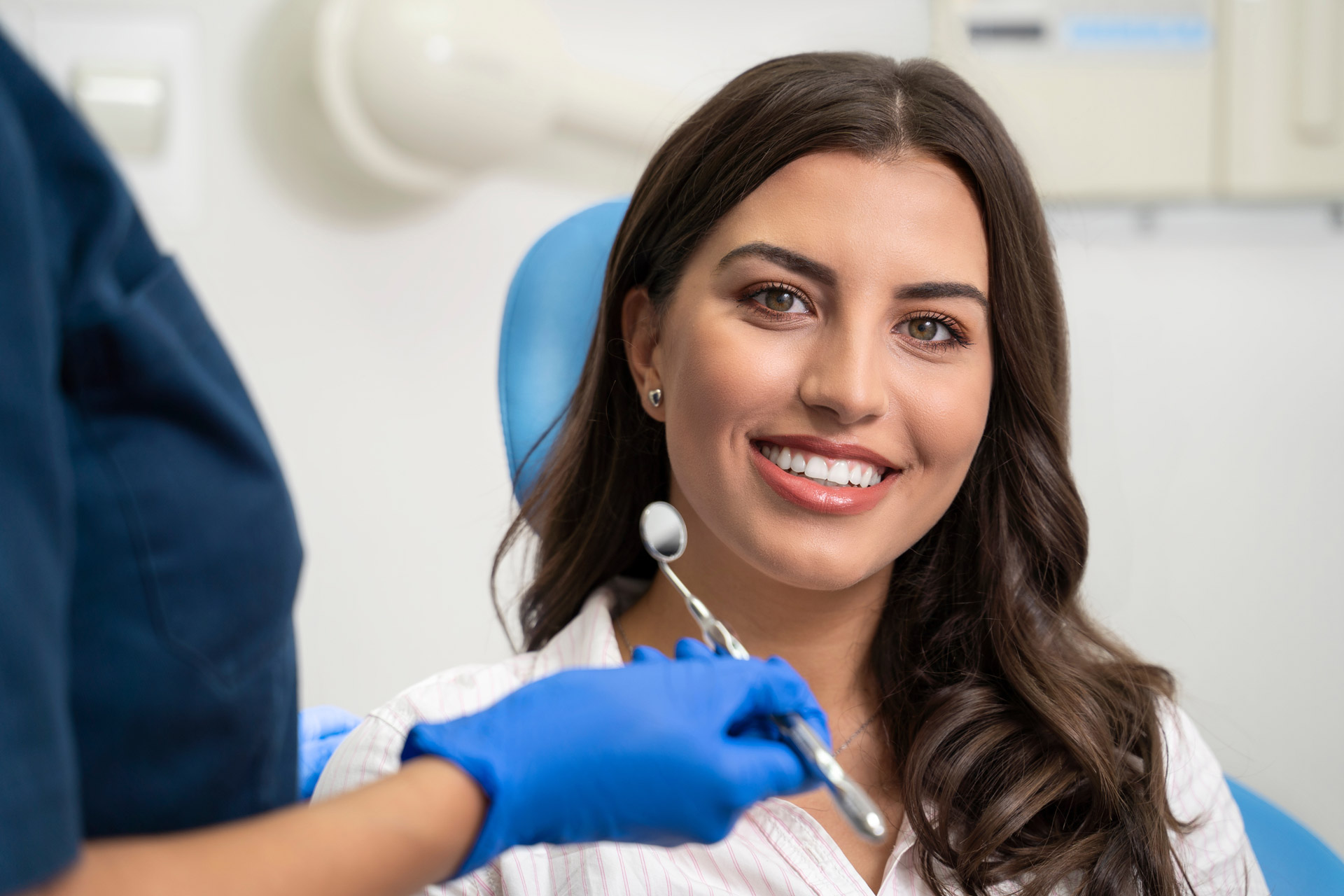 patient smiles after a dental implants procedure