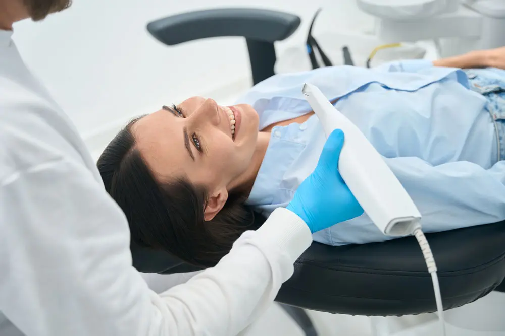 a patient receiving dental cleaning
