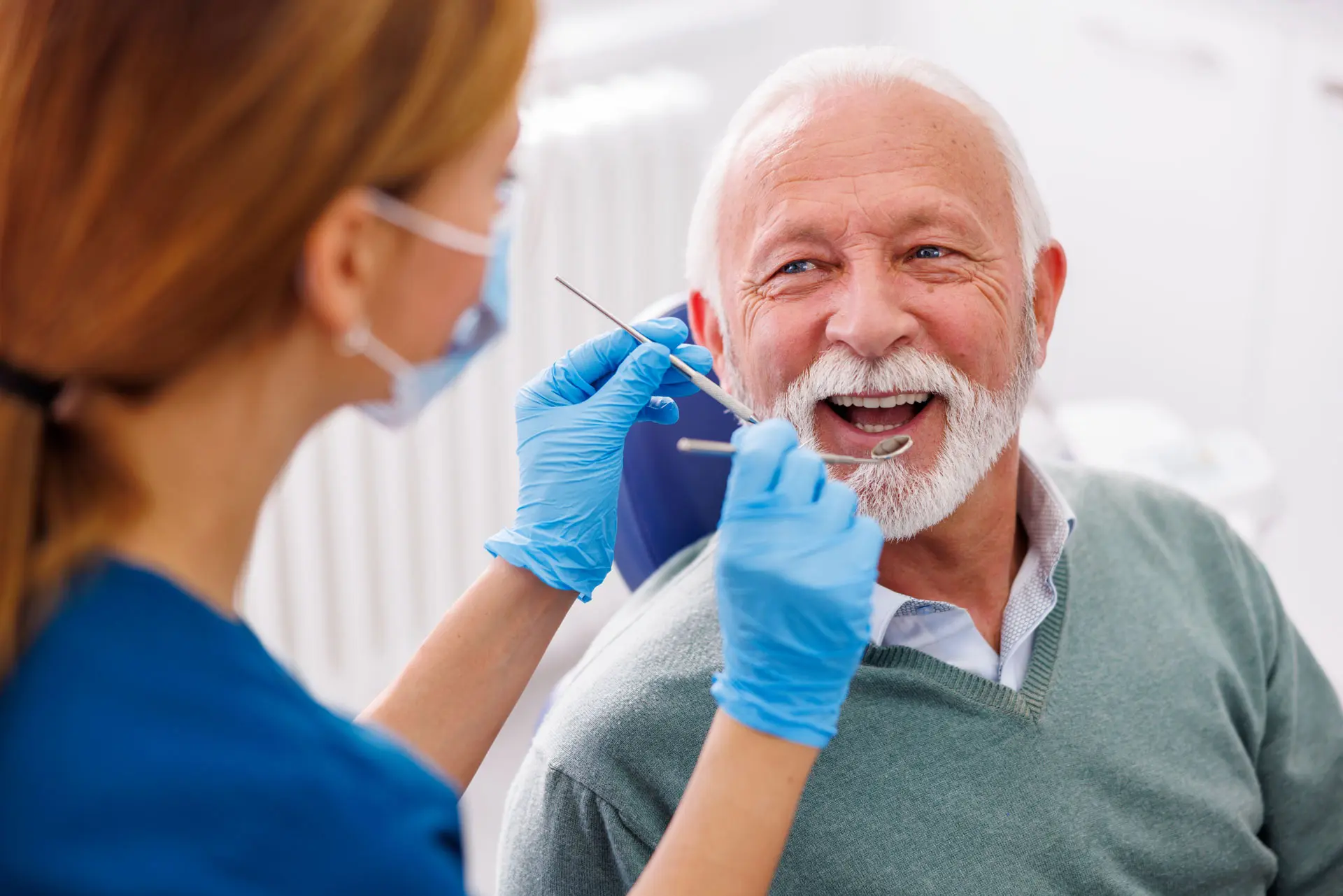 an elderly getting teeth cleaning done