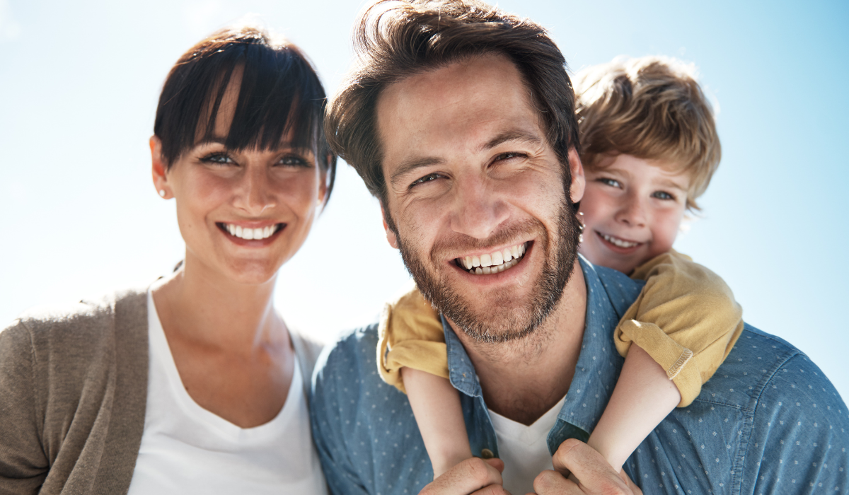 a young family outdoors in summer