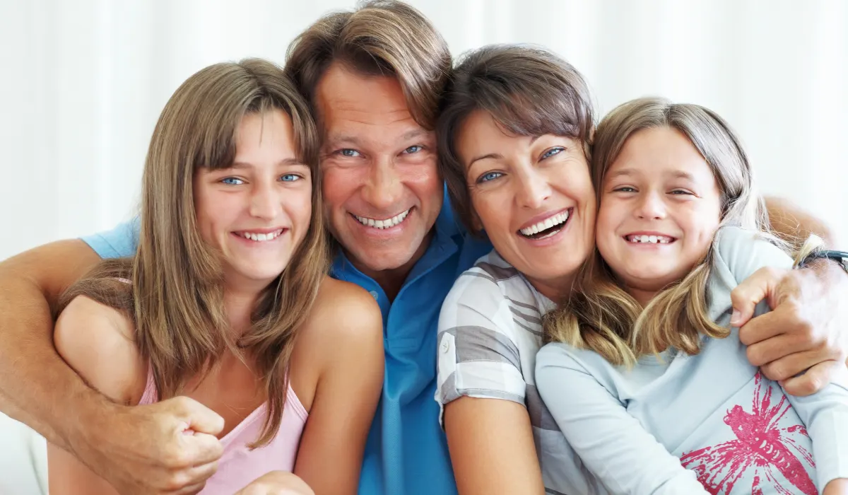 Smiling family with two children at a dental clinic